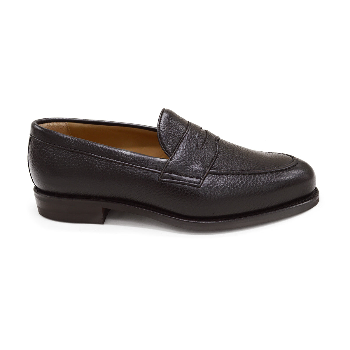 A dark brown deerskin penny loafer with a velvety soft texture and a classic round toe shape on a white background.
