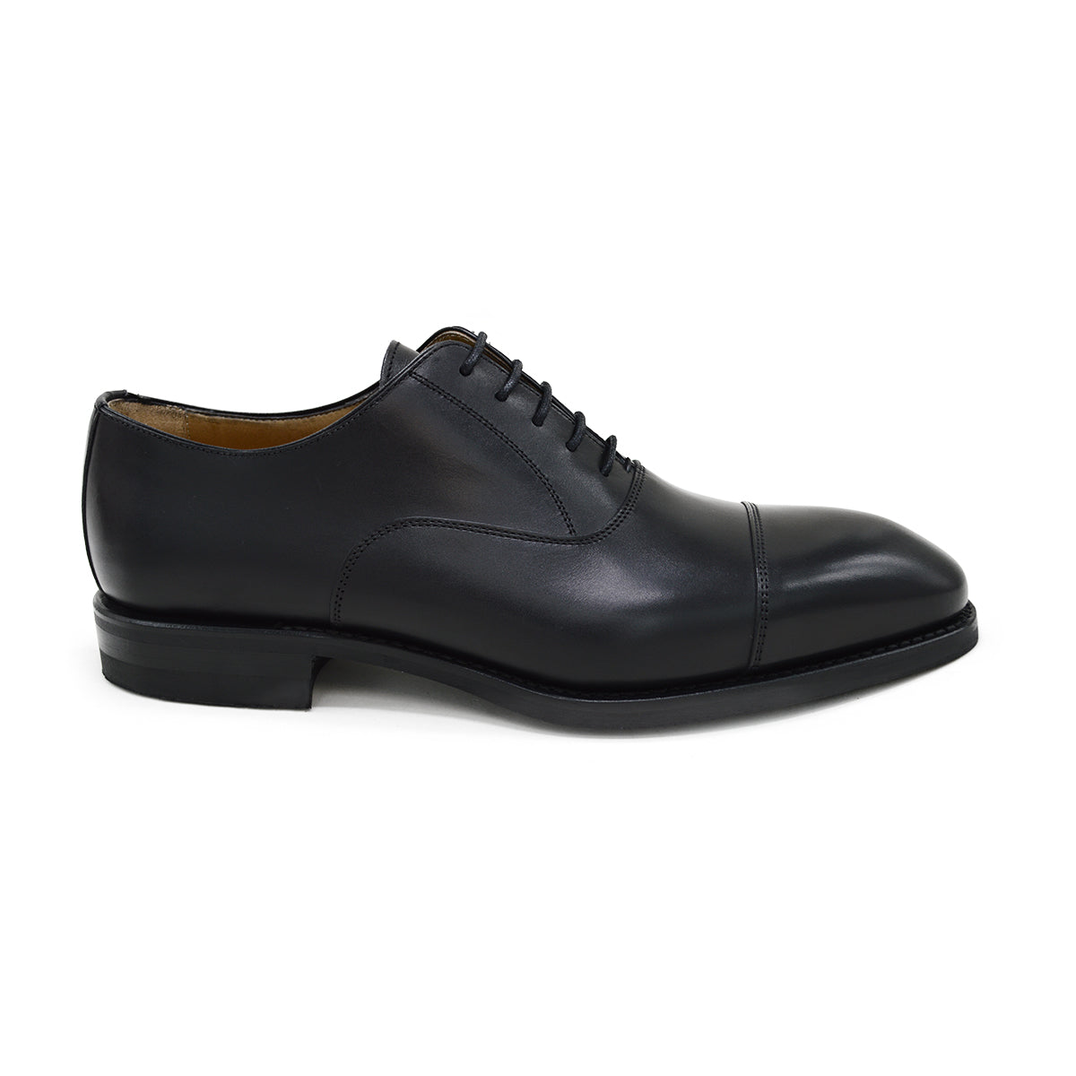 A Berwick 1707 black leather Oxford shoe with a chisel toe and lace-up closure with a Dainite rubber studded sole, on a white background.