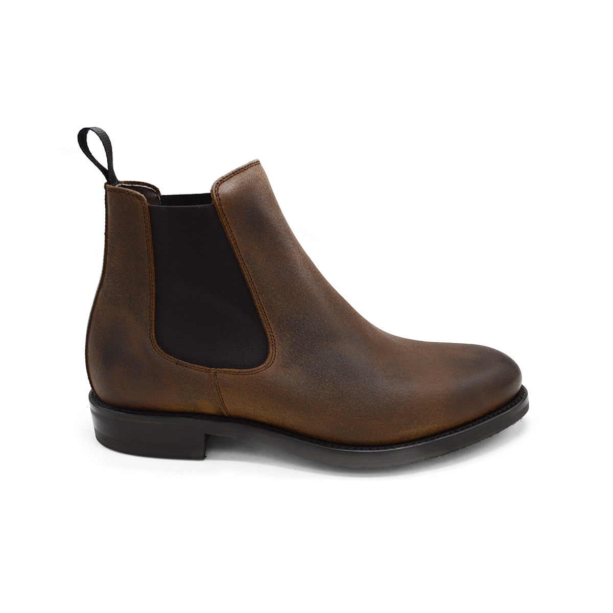 A dark brown Chelsea boot with a waxy leather finish and a contrasting black elastic side panel. The boot has a low heel and a small pull tab at the rear.