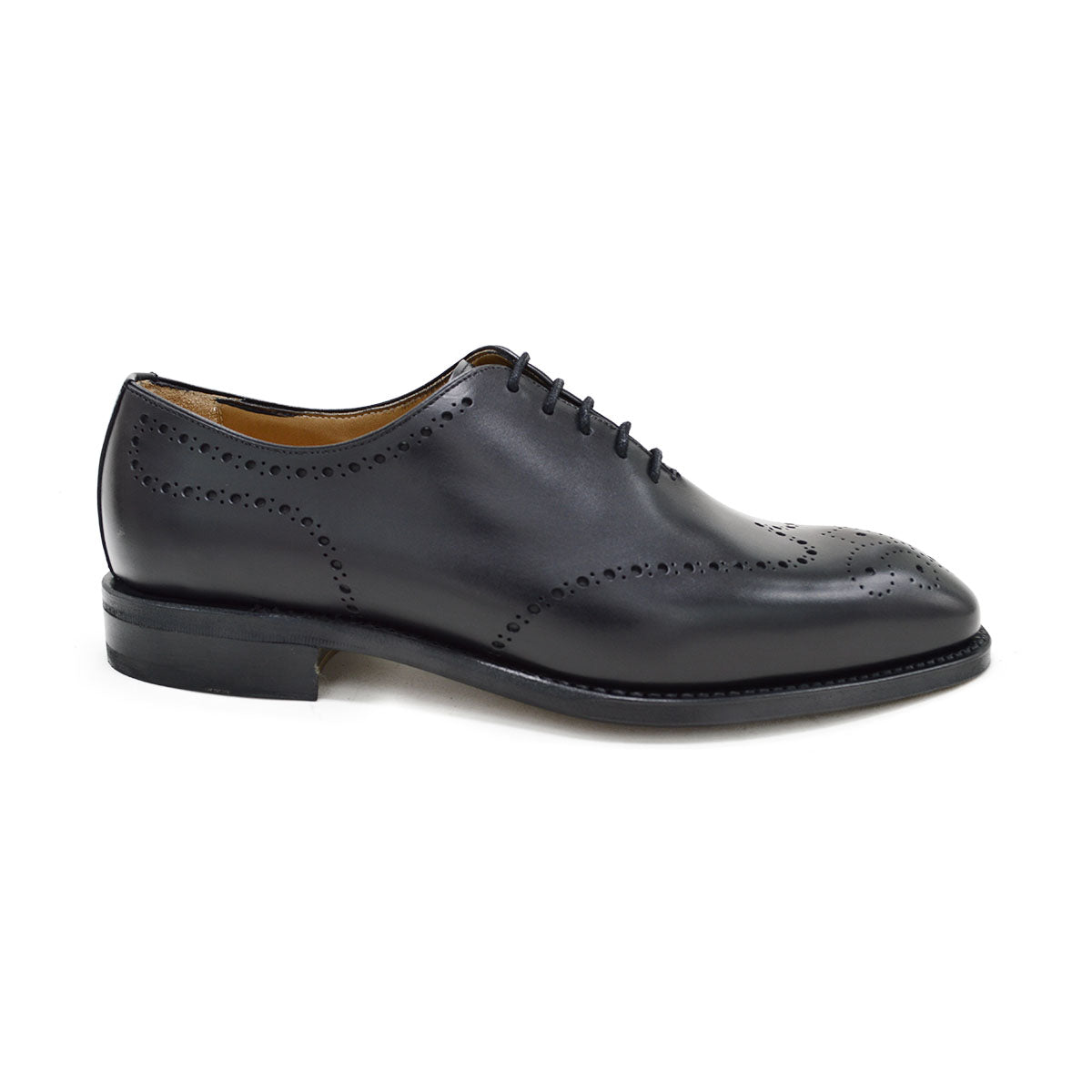 A black wholecut Oxford brogue shoe with a brogue pattern on the upper, a lace-up closure, and a goodyear welted leather sole.