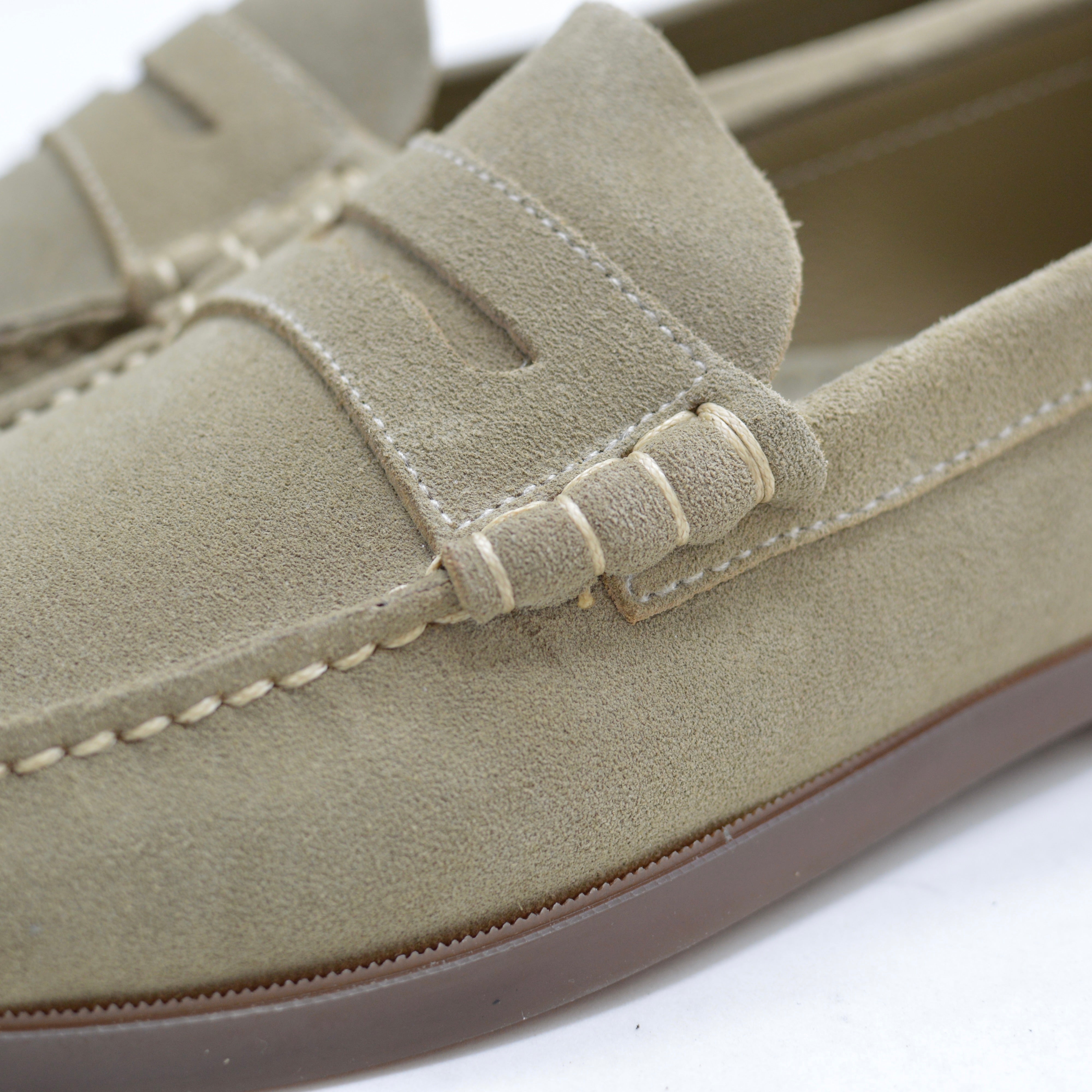 Close-up of a sand loafer shoe on a white background