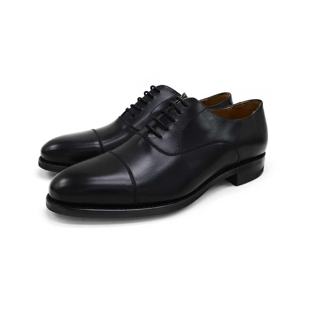 A Berwick 1707 black Oxford shoe with a polished, smooth upper and a Dainite rubber sole.