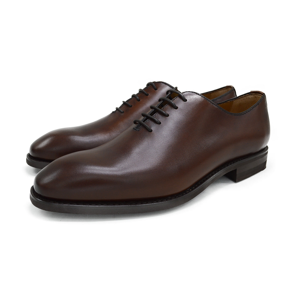 A Berwick 1707 brown leather wholecut oxford shoe with a lace-up closure and a round toe.