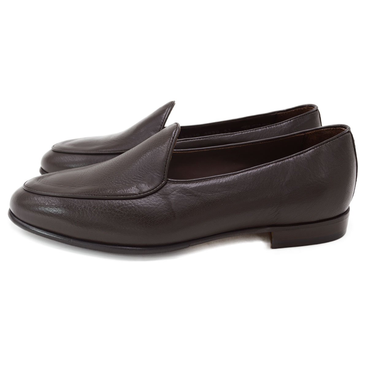 A dark brown deerskin leather Belgian loafer with an almond toe shape and minimal stitching.