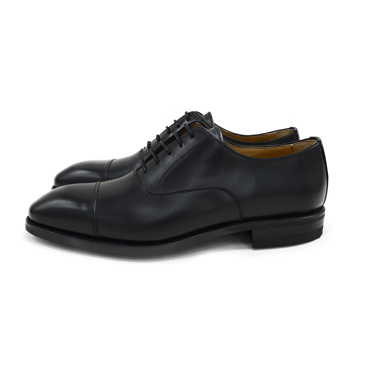 A Berwick 1707 black leather Oxford shoe with a chisel toe and lace-up closure with a Dainite rubber studded sole, on a white background.