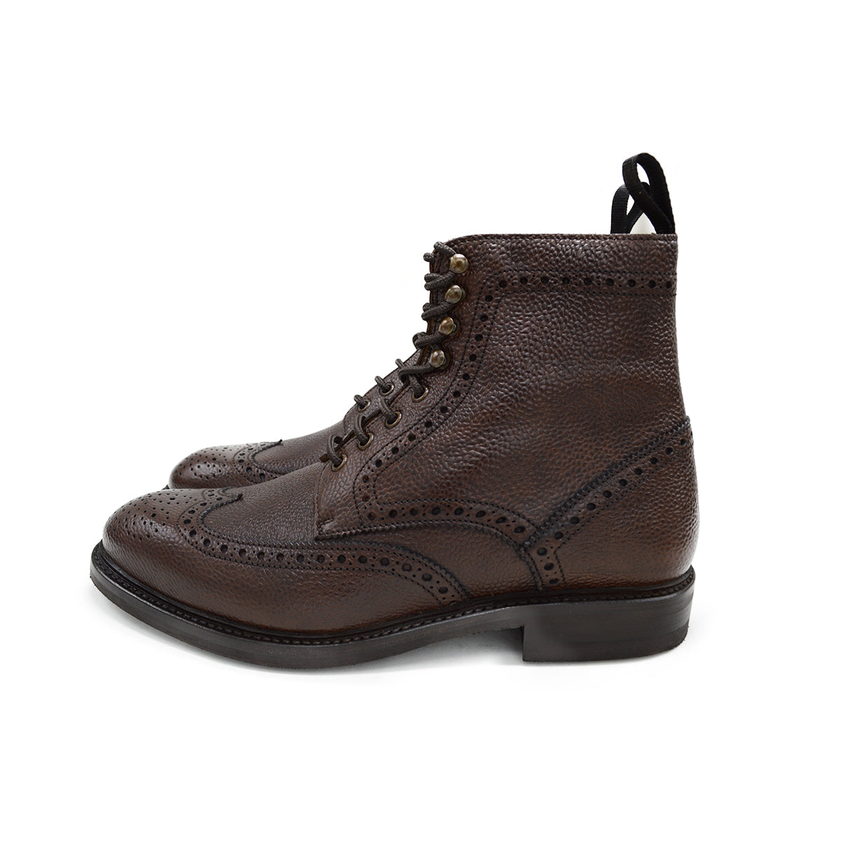 A Berwick 1707 dark brown brogue boot with a lace-up closure, round toe shape, and a Dainite rubber sole.