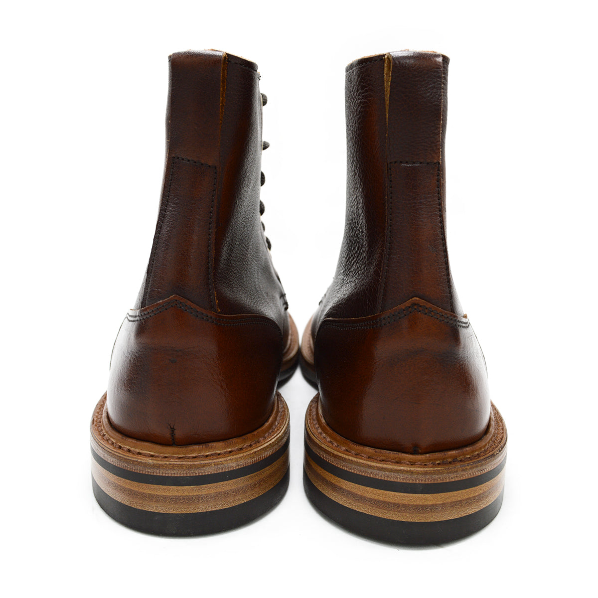A brown leather service boot with a dainite sole and brass eyelets, designed for the forestry industry.