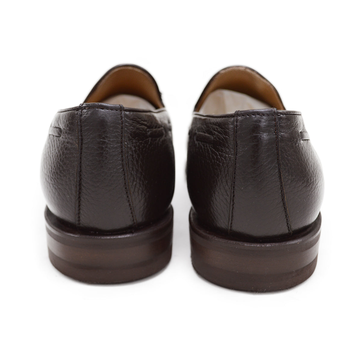 A Berwick 1707 dark brown deerskin slip-on loafer with a tassel detail on the vamp & Dainite sole, displayed on a plain background