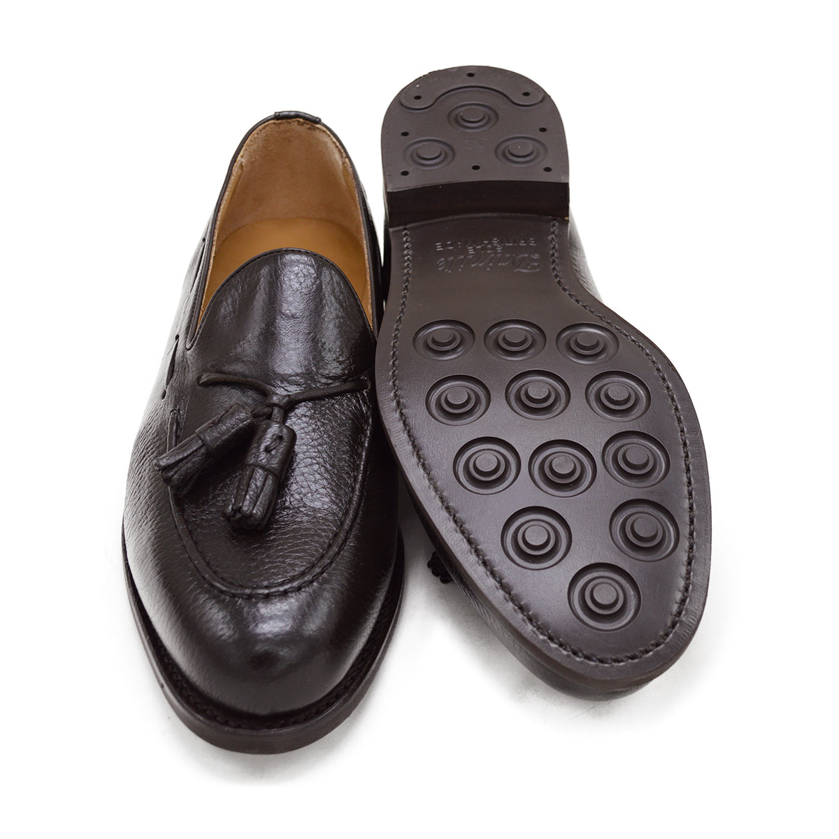 A Berwick 1707 dark brown deerskin slip-on loafer with a tassel detail on the vamp & Dainite sole, displayed on a plain background