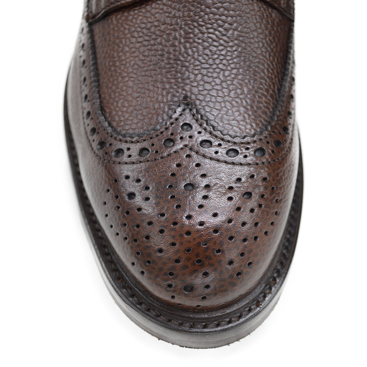 A Berwick 1707 dark brown brogue boot with a lace-up closure, round toe shape, and a Dainite rubber sole.
