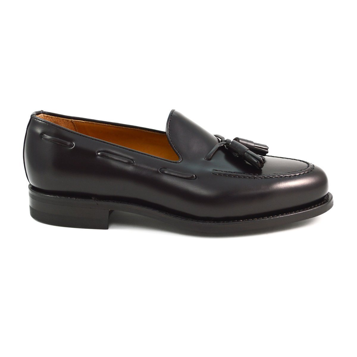 A Berwick 1707 dark brown tasselled slip-on shoe with a polished, smooth upper and a Dainite rubber sole.
