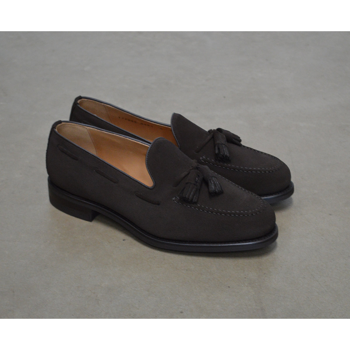 A classic dark brown suede slip-on shoe with tassels, by Berwick 1707, with a goodyear welted dainite sole.