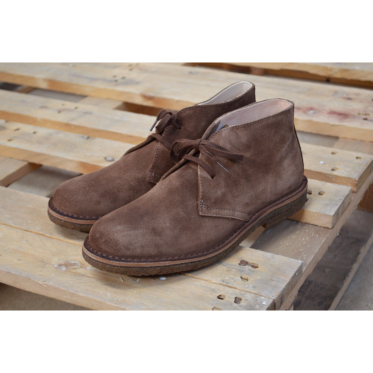 A brown suede Greenflex Desert Boot with a lace-up closure, designed by Astorflex.