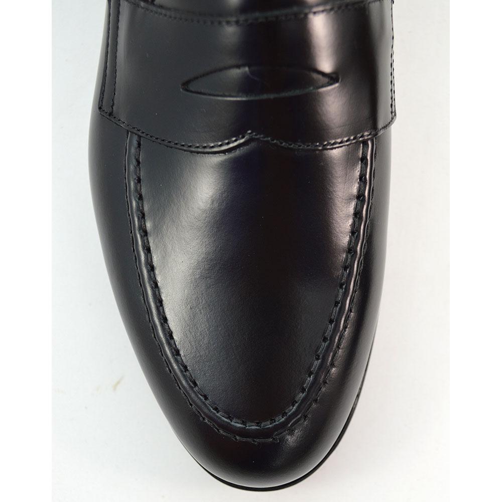 A black high-shine Berwick 1707 Penny Loafer with a round toe and Dainite rubber sole.