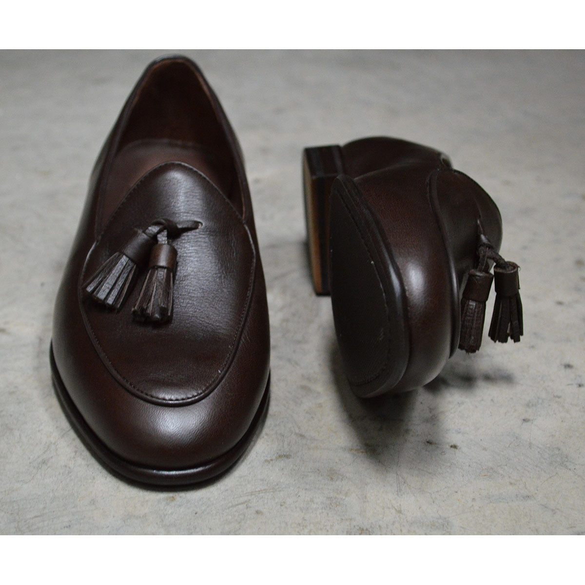 A Berwick 1707 dark brown deerskin Belgian loafer with a tassel detail on the vamp
