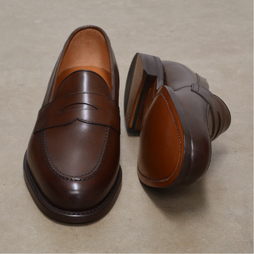 Berwick 1707 Brown leather loafer shoe on a polished concrete background