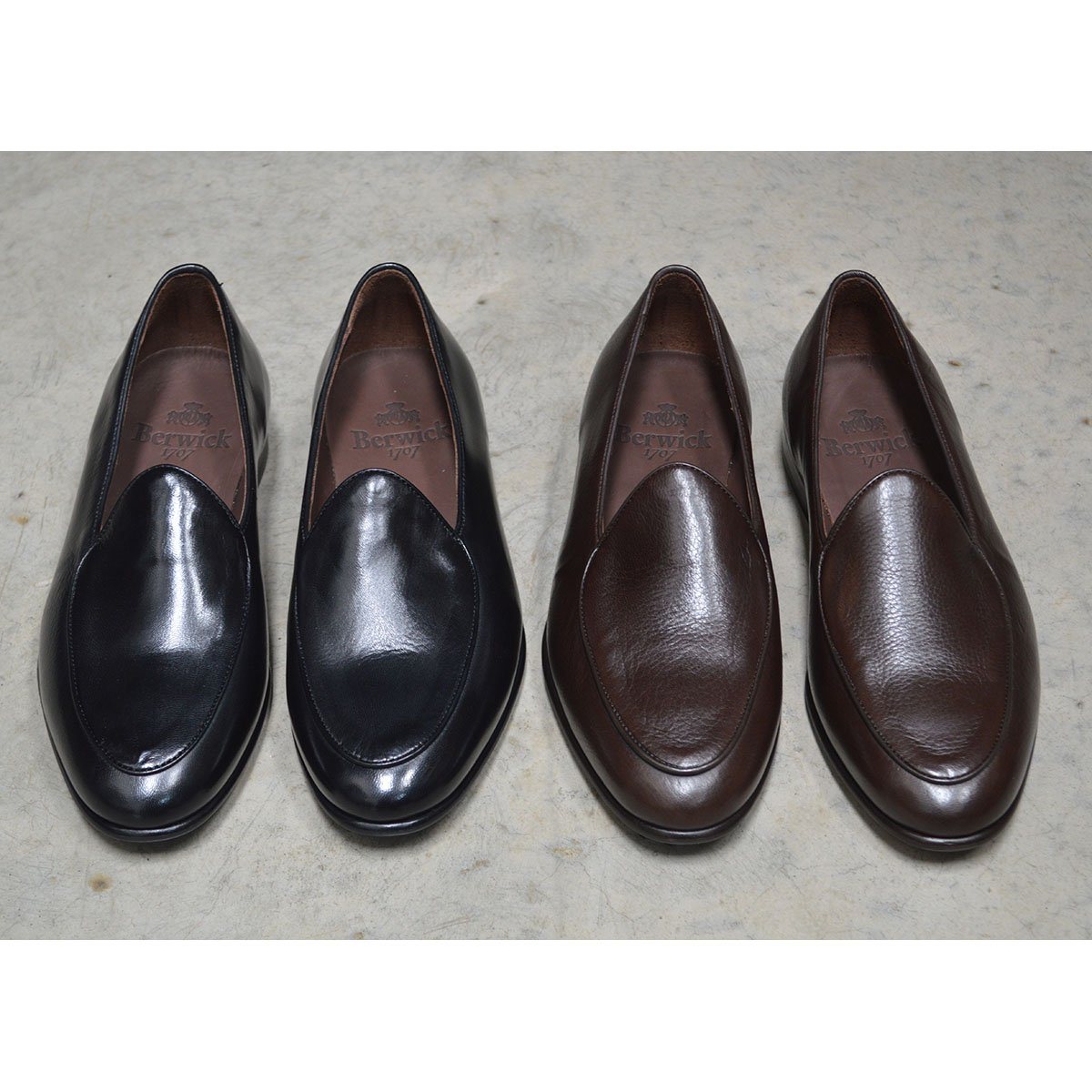 A dark brown deerskin leather Belgian loafer with an almond toe shape and minimal stitching.