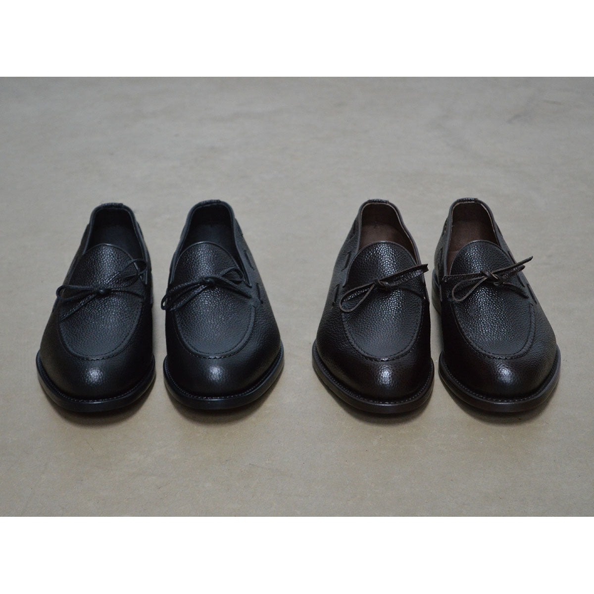 A Berwick 1707 classic black unlined laced slip-on loafer with a Goodyear welted leather sole.