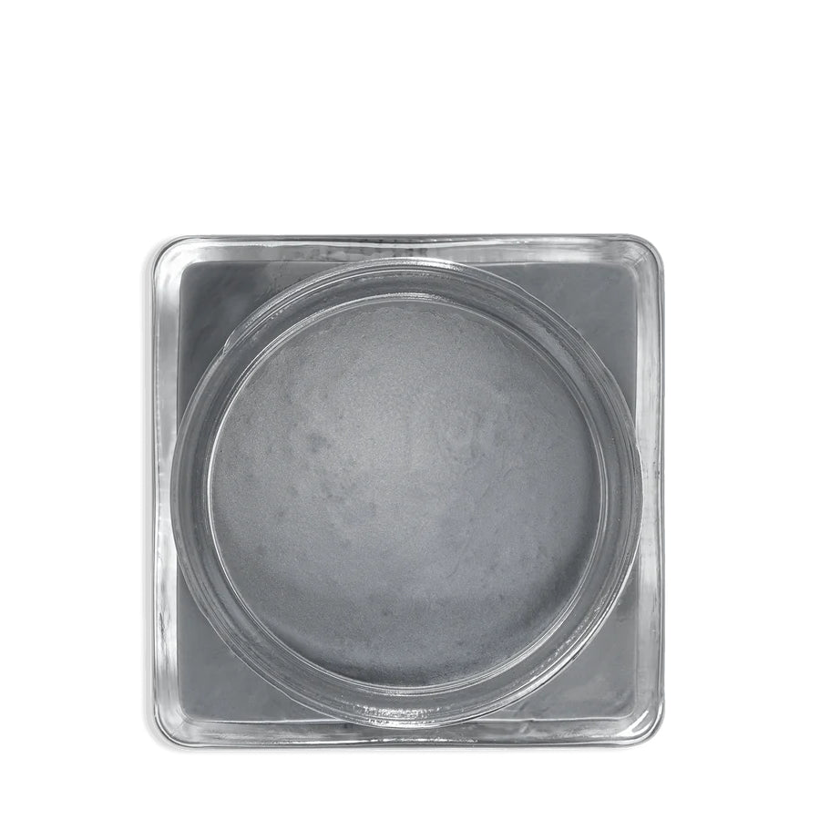 A glass jar 'SAPHIR' containing cream shoe polish.