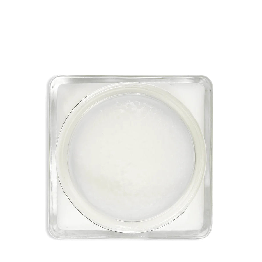 A glass jar 'SAPHIR' containing cream shoe polish.