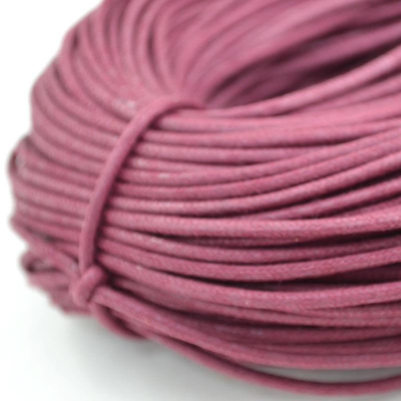 pink coloured waxed round casual shoe laces, tied in individual bundles.