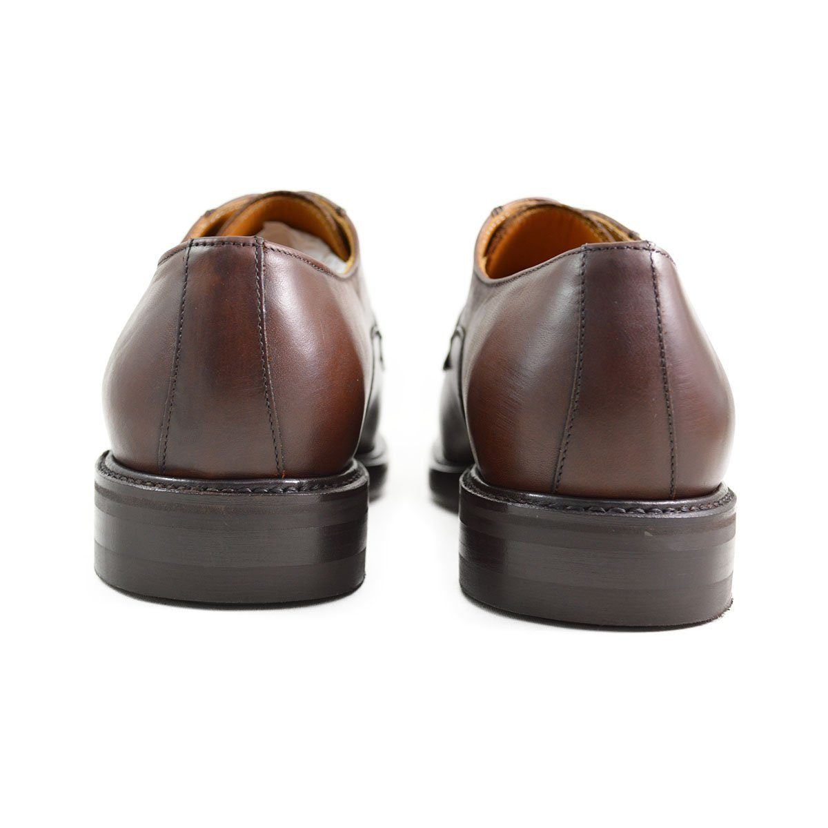 A pair of dark brown Berwick 1707 Split Toe Derby shoes with laces, set against a white background.