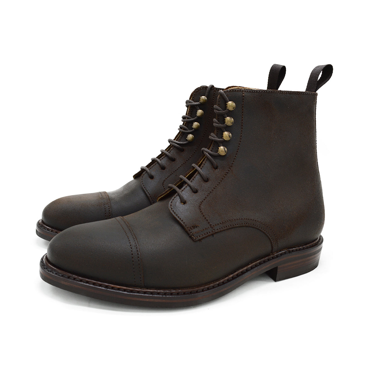 A Berwick 1707 dark brown, waxed roughout suede classic country toe cap derby boot with Dainite rubber sole and lace-up closure.