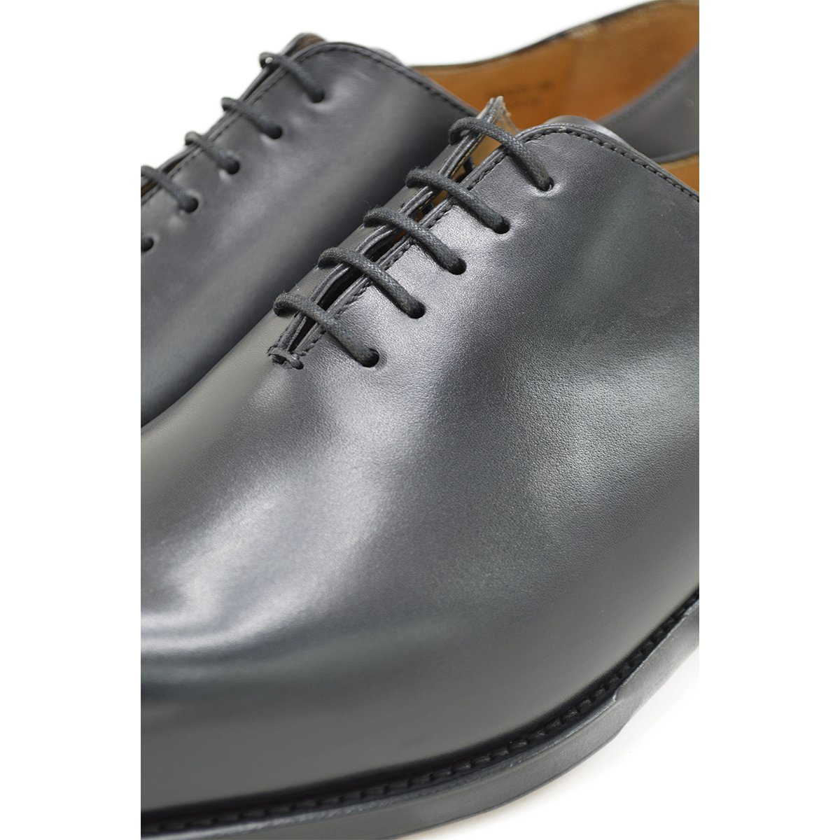 A Berwick 1707 black leather Oxford shoe with a wholecut design and lace-up closure, side view.