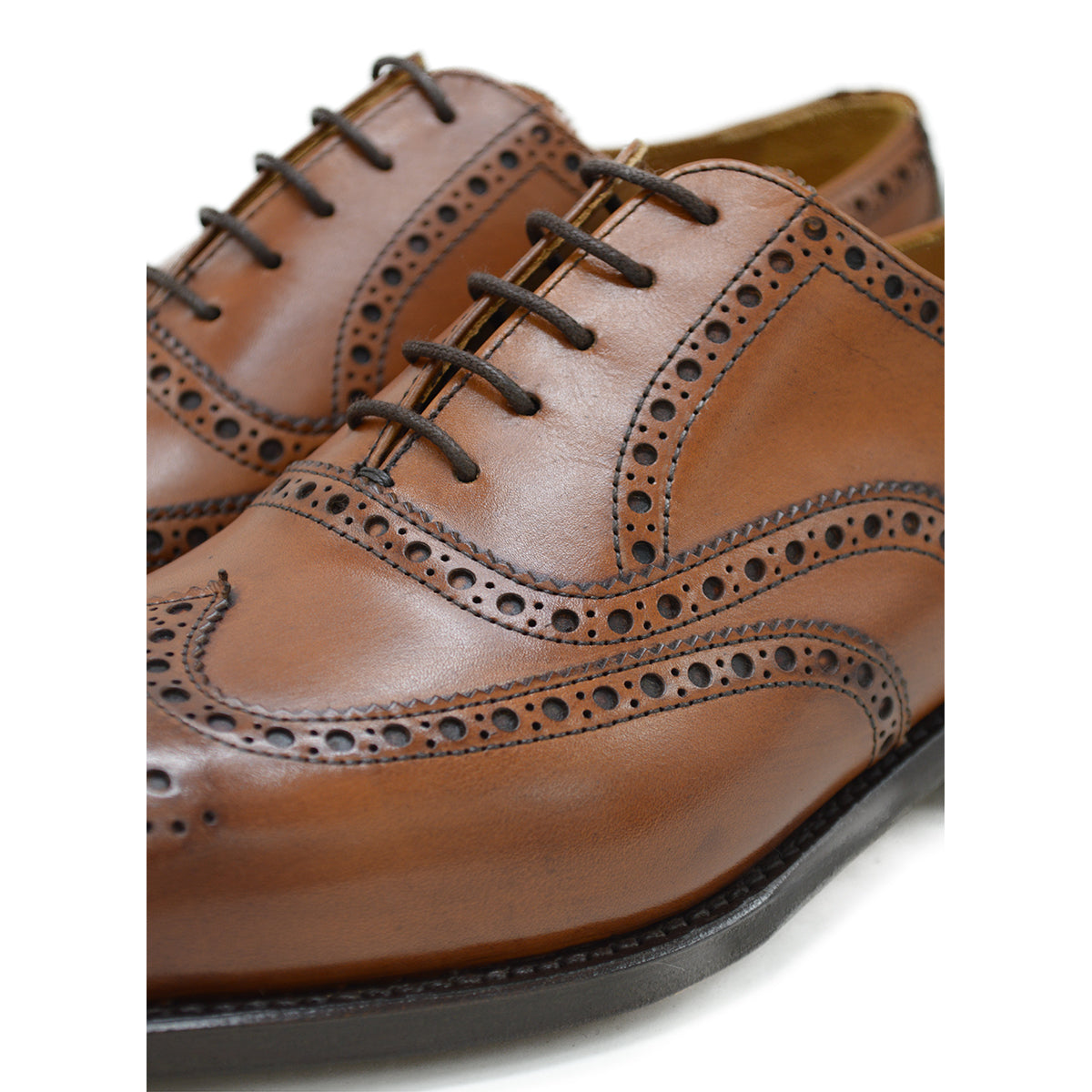 A tan Berwick 1707 Oxford Brogue shoe with intricate brogue detailing and a goodyear welted leather sole.