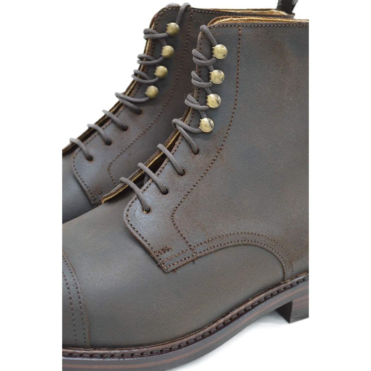 A Berwick 1707 dark brown, waxed roughout suede classic country toe cap derby boot with Dainite rubber sole and lace-up closure.