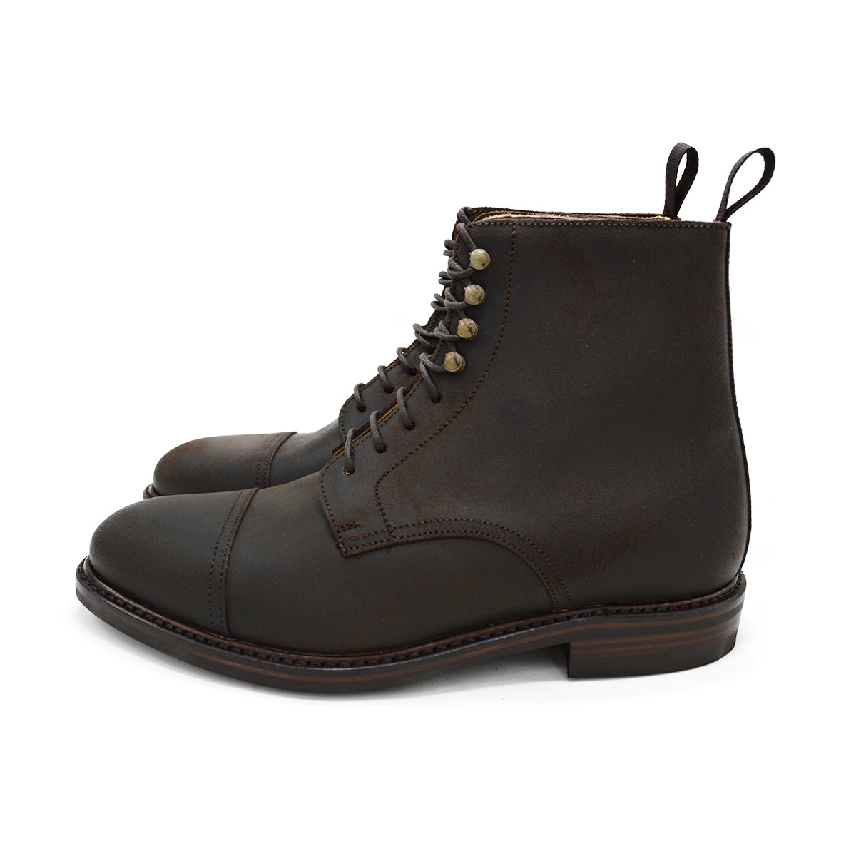 A Berwick 1707 dark brown, waxed roughout suede classic country toe cap derby boot with Dainite rubber sole and lace-up closure.