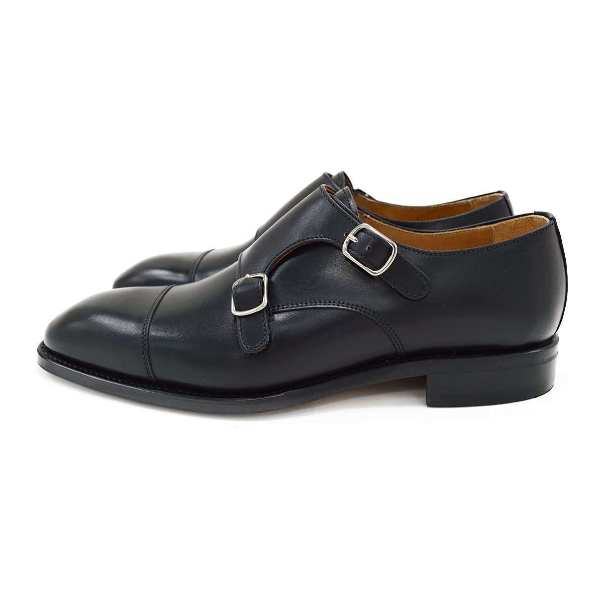 A Berwick 1707 lack double monk shoe with two buckle straps, made from calf leather and featuring a Goodyear welted leather sole.