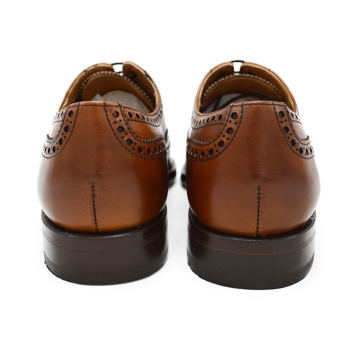 A tan Berwick 1707 Oxford Brogue shoe with intricate brogue detailing and a goodyear welted leather sole.