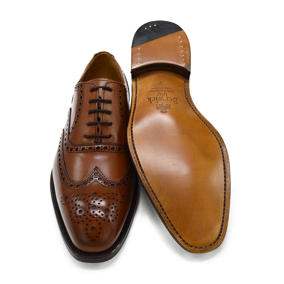 A tan Berwick 1707 Oxford Brogue shoe with intricate brogue detailing and a goodyear welted leather sole.