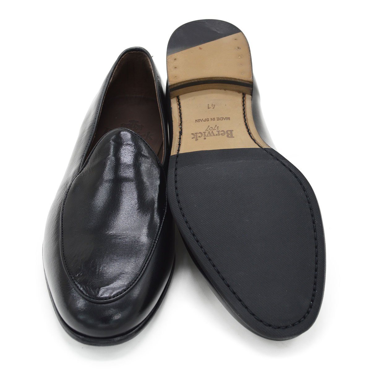 A classic black Berwick 1707 Belgian loafer with a smooth deerskin leather upper, an almond toe shape, and a low heel.