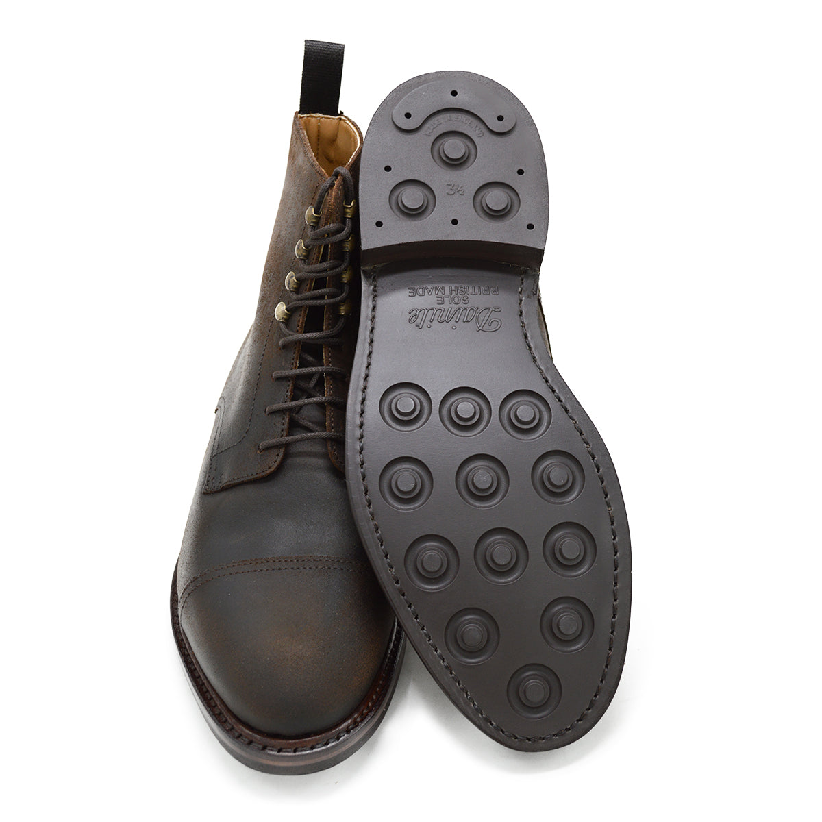 A Berwick 1707 dark brown, waxed roughout suede classic country toe cap derby boot with Dainite rubber sole and lace-up closure.