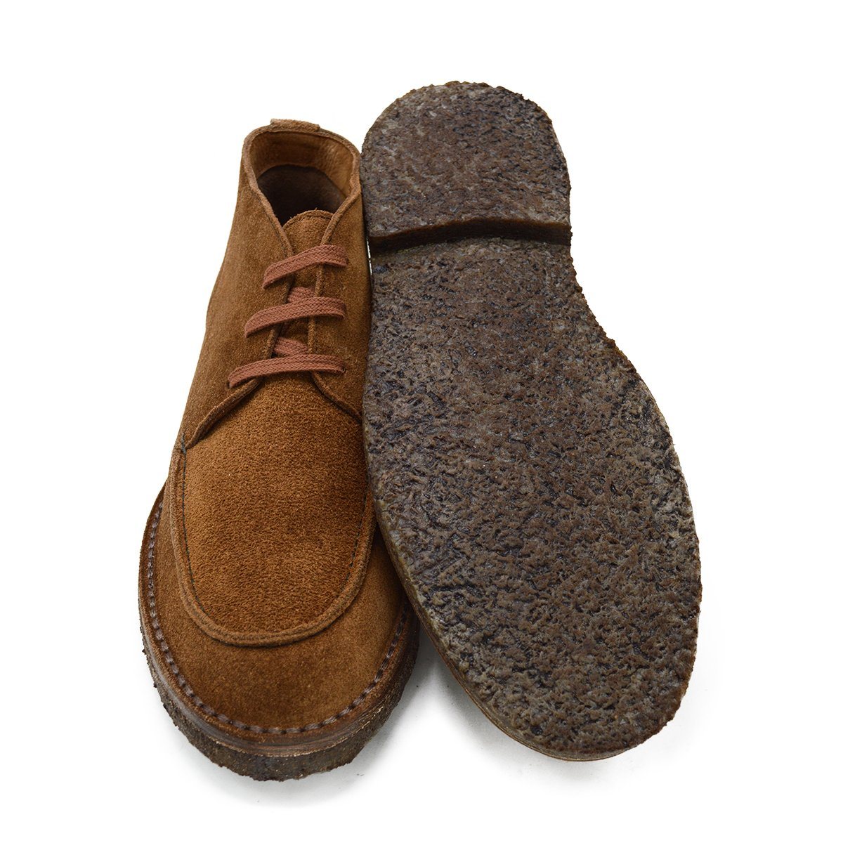 A brown Berwick 1707 5432 Apron Boot with lace-up closure, handcrafted from reverse kudu suede, featuring moccasin stitching and a crepe rubber sole.