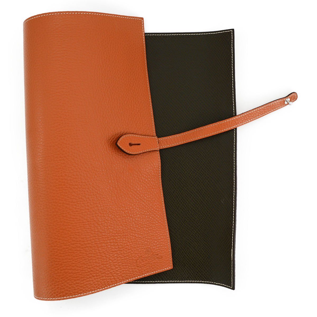 A Saphir Medaille D'Or rolled-up orange leather shoeshine mat with a nickel stud on the exterior.