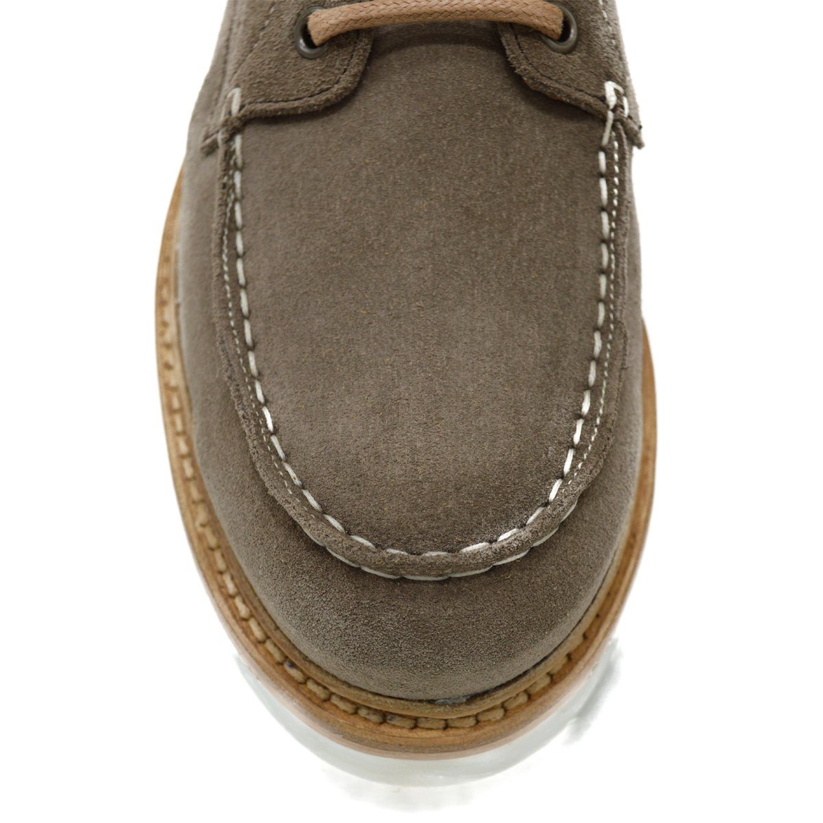 A grey and tan suede apron boot with lace-up closure, featuring a white sole and a natural welt.