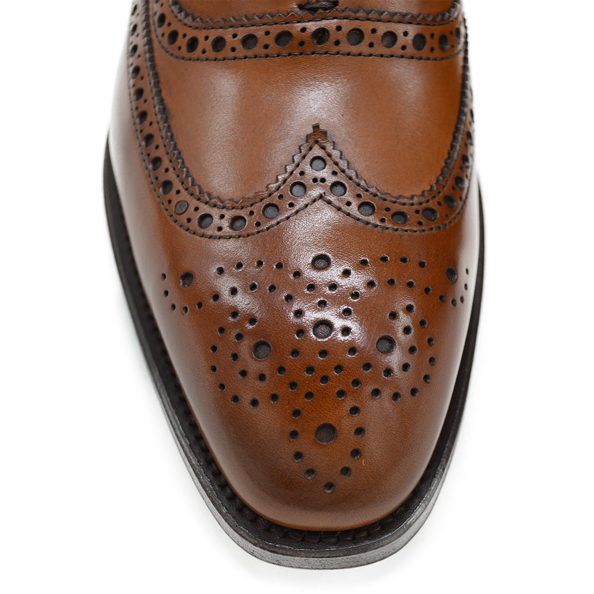 A tan Berwick 1707 Oxford Brogue shoe with intricate brogue detailing and a goodyear welted leather sole.