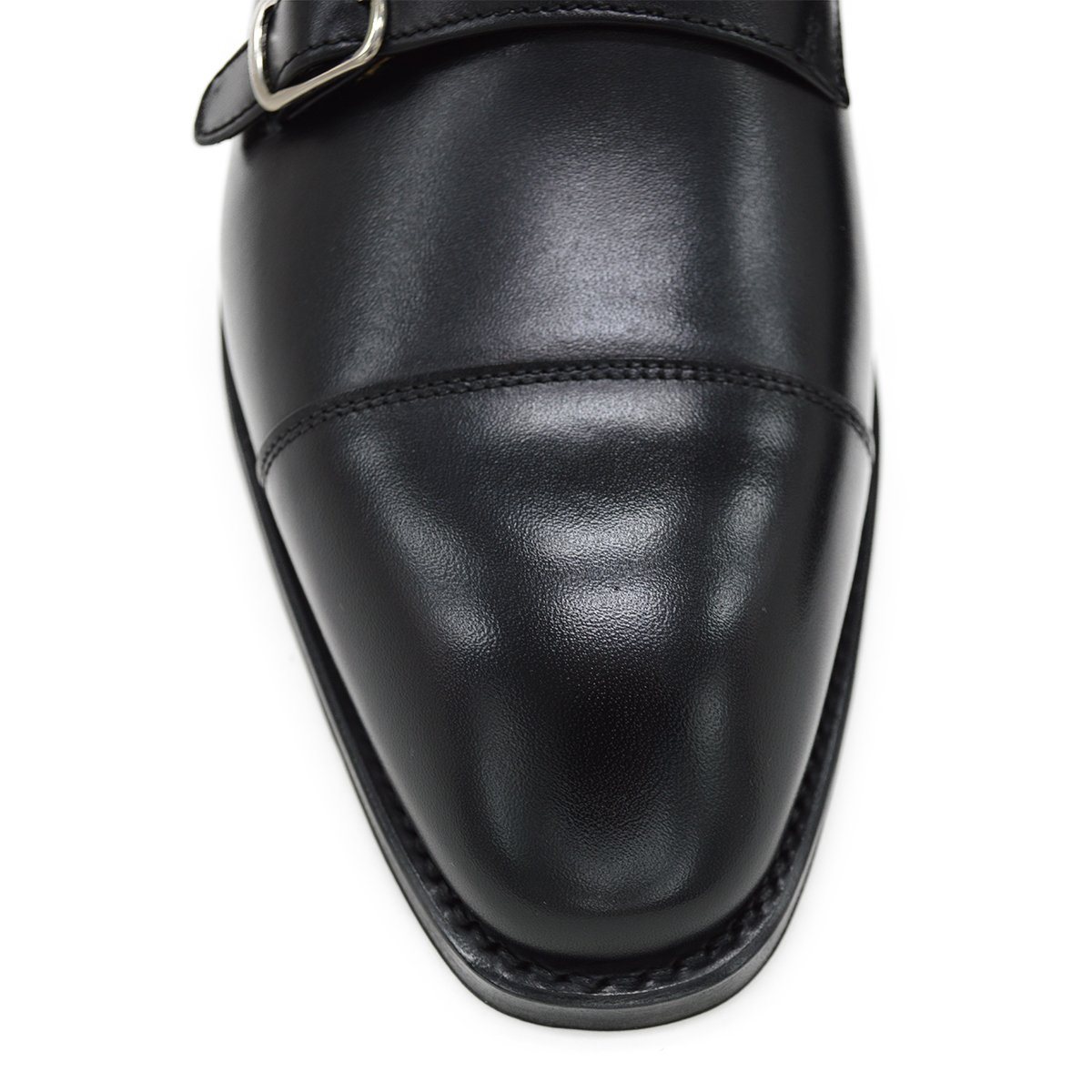 A Berwick 1707 lack double monk shoe with two buckle straps, made from calf leather and featuring a Goodyear welted leather sole.