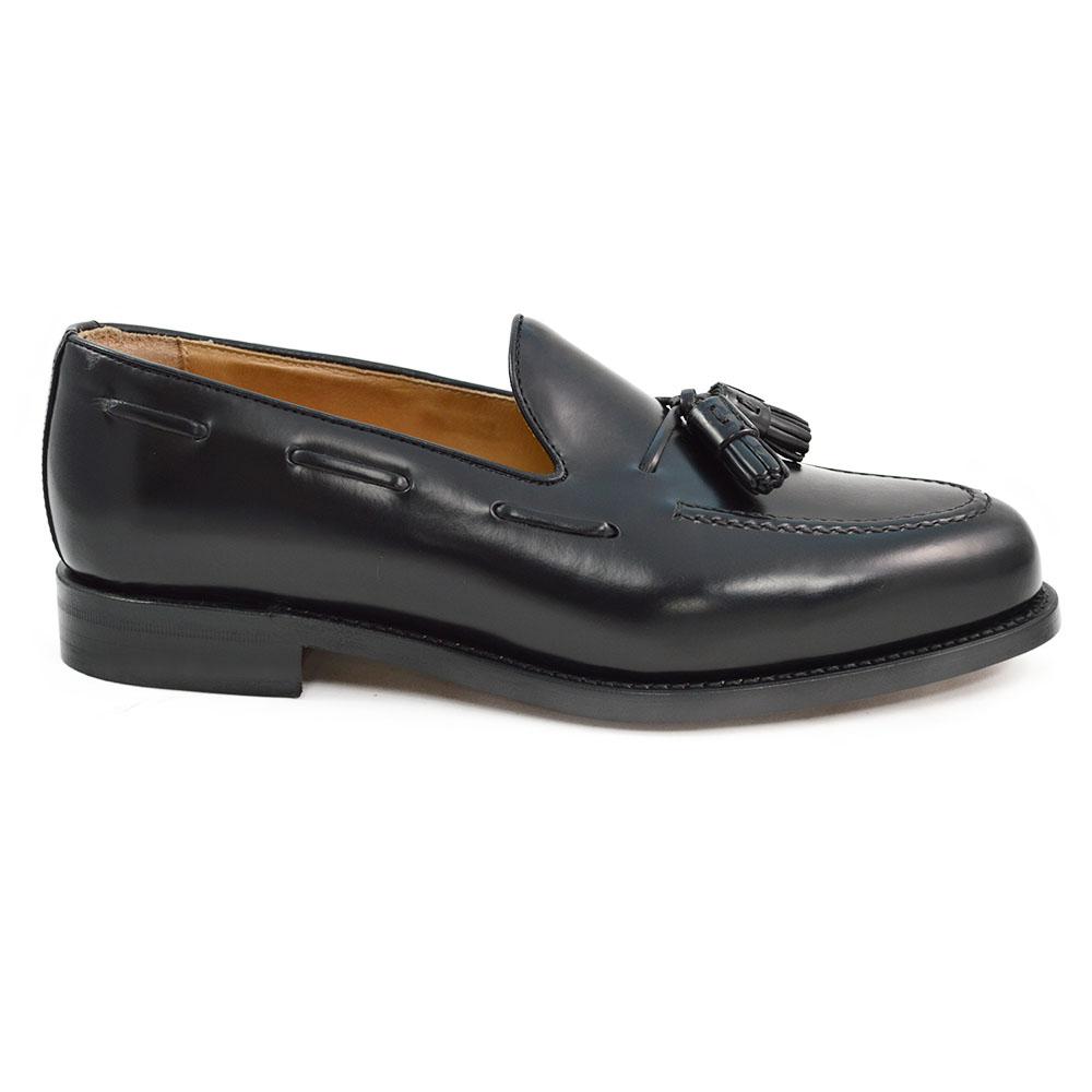 A black tasselled slip-on shoe with a high shine finish and a classic round toe.