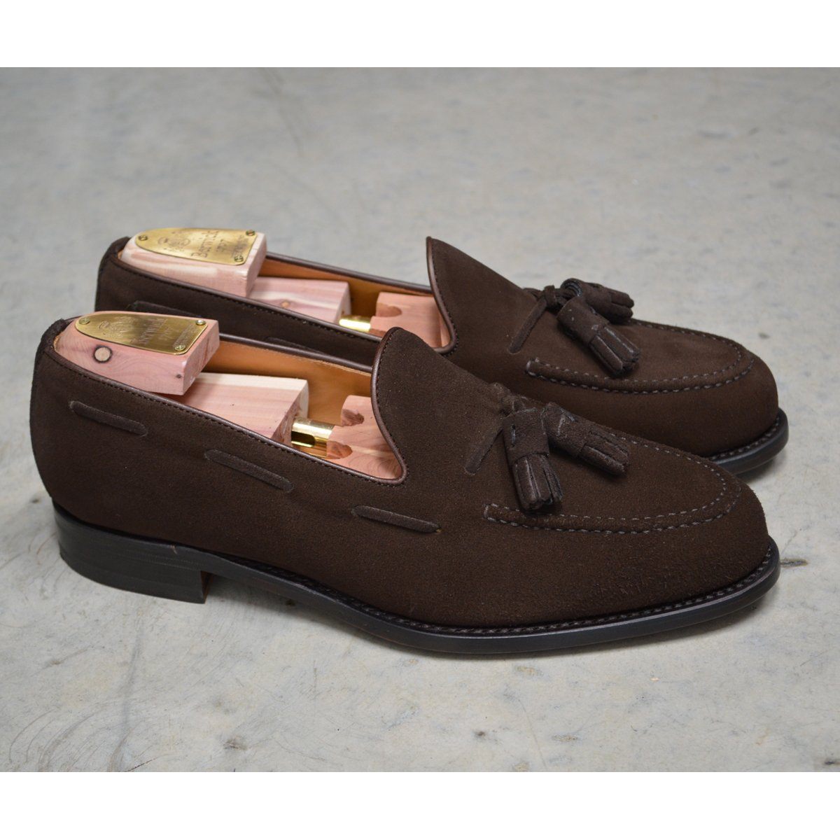 A classic dark brown suede slip-on shoe with tassels, by Berwick 1707.