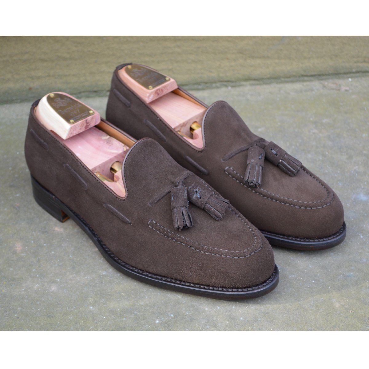 A classic dark brown suede slip-on shoe with tassels, by Berwick 1707.