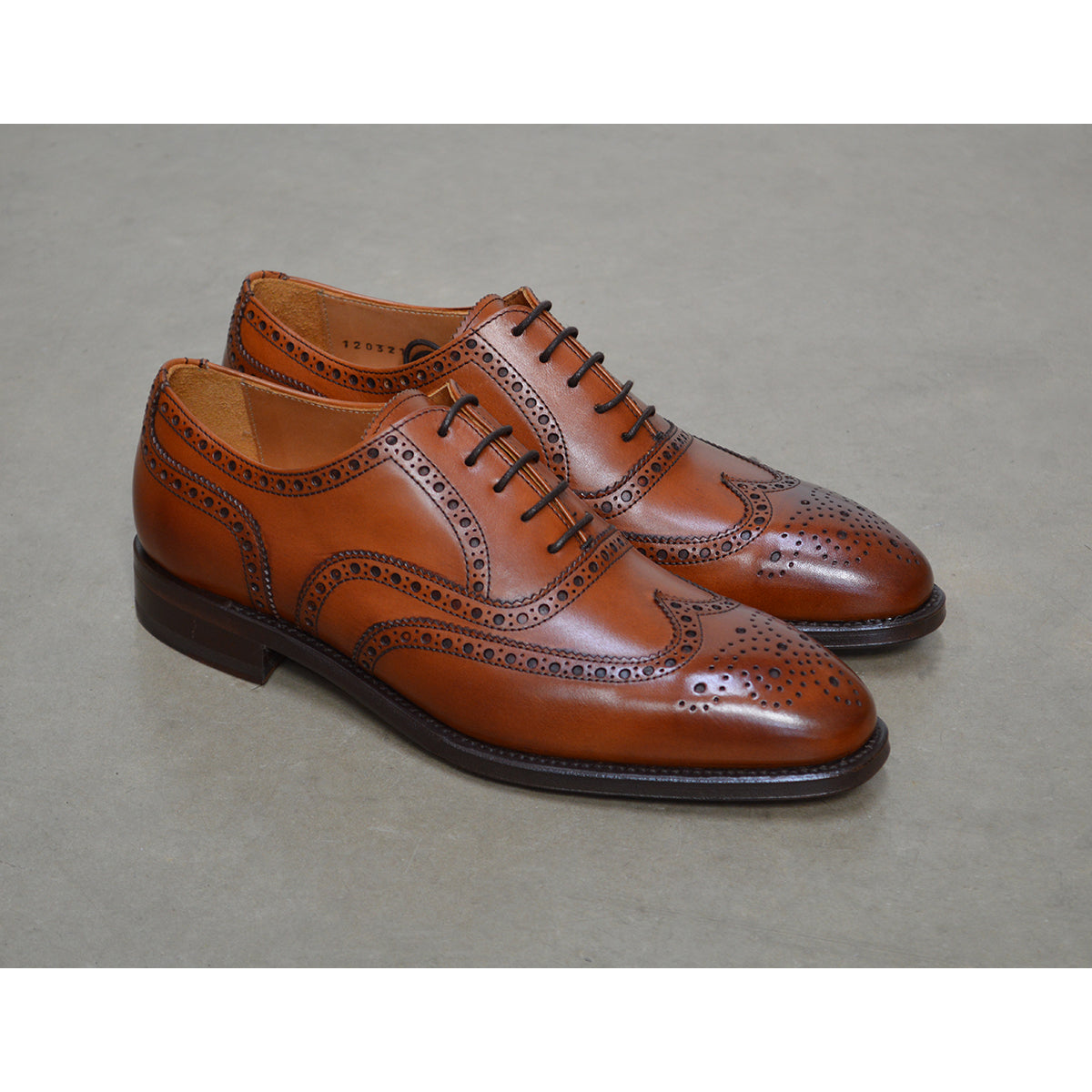 A tan Berwick 1707 Oxford Brogue shoe with intricate brogue detailing and a goodyear welted leather sole.