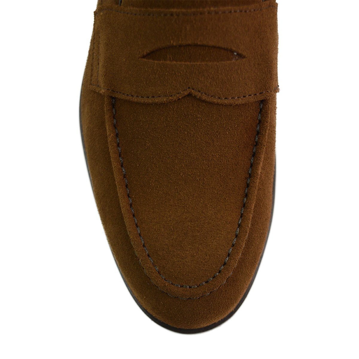 A brown suede penny loafer with a Dainite rubber sole, showing a classic round toe shape and a signature penny slot detail & Dainite Soles