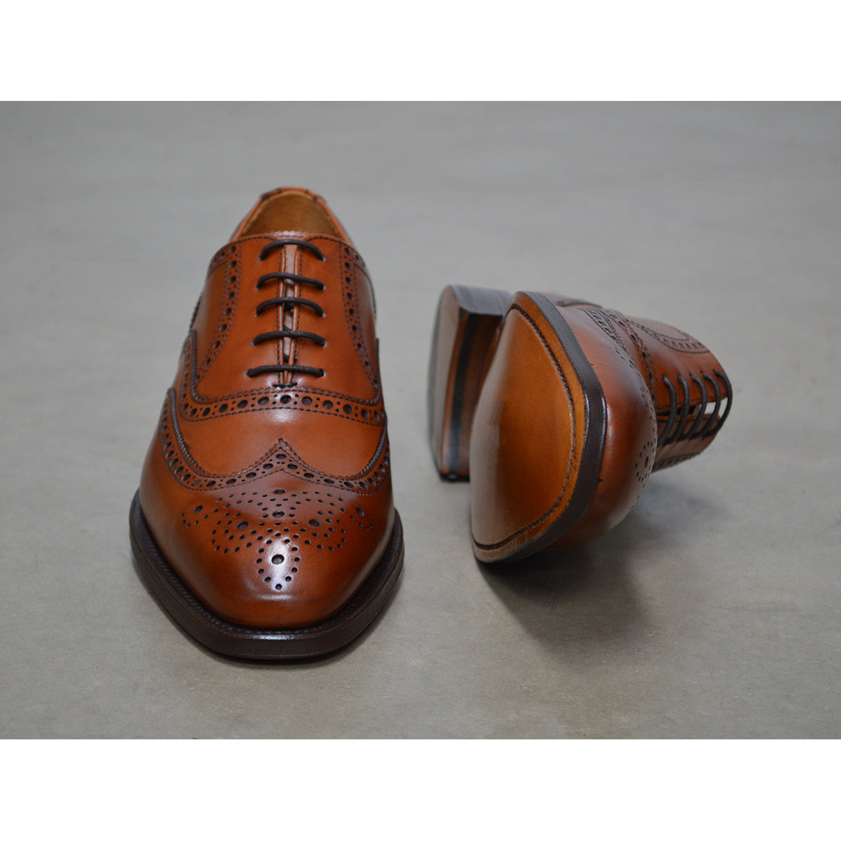 A tan Berwick 1707 Oxford Brogue shoe with intricate brogue detailing and a goodyear welted leather sole.