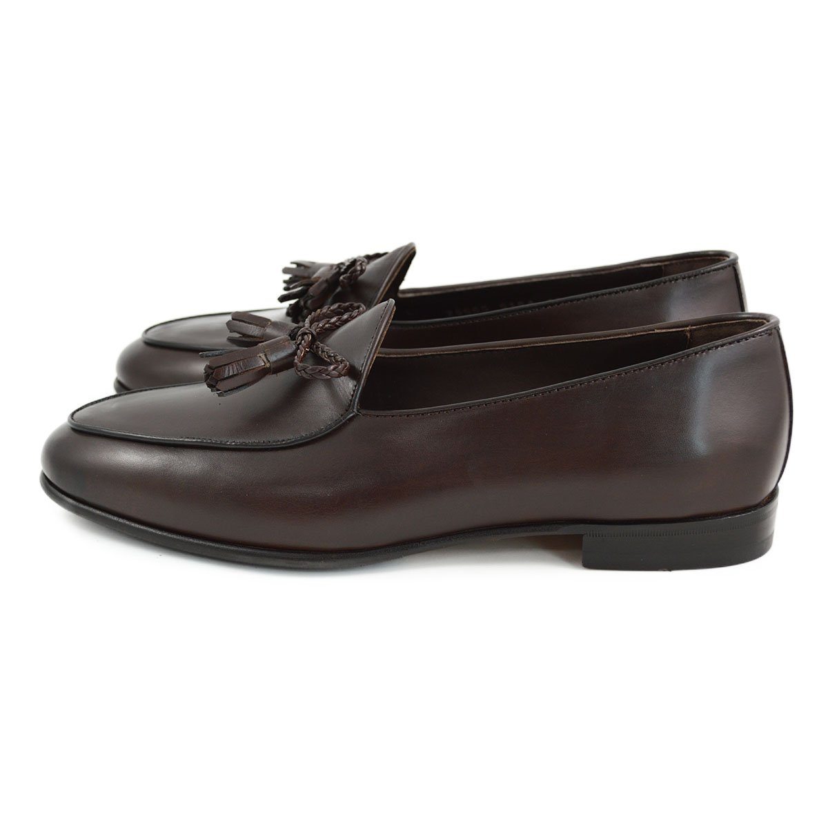 A Berwick 1 707 dark brown leather Belgian loafer with a braided leather bow tie and tassel adornment.
