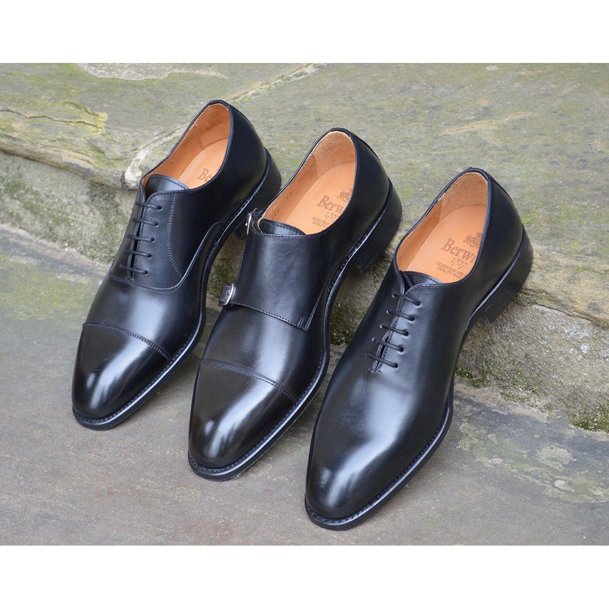 A black, boxcalf leather Oxford shoe with a chisel toe and lace-up closure, crafted in Spain.