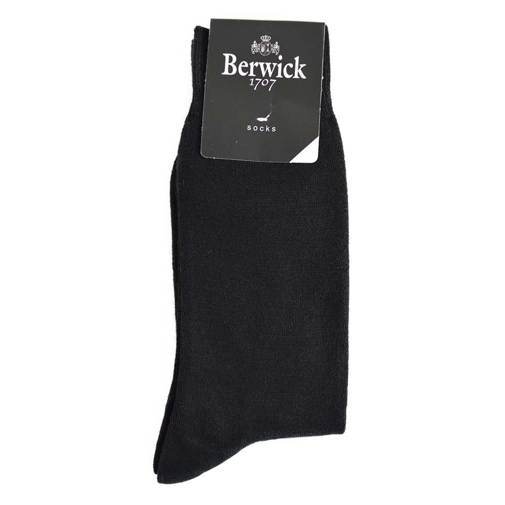 A pair of black plain knit socks with the Berwick 1707 brand tag visible.